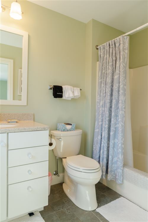 East suite bathroom with tub and shower
